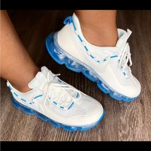 White with blue bottom sneakers.